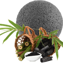 Load image into Gallery viewer, eco friendly and natural black bamboo charcoal konjac facial and body sponge with wicker baskets in front containing bamboo plant and charcoal