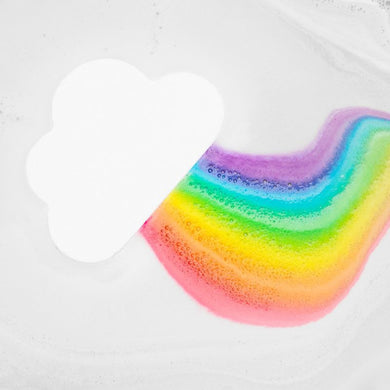 white rainbow bath bomb in water showing the rainbow colours.