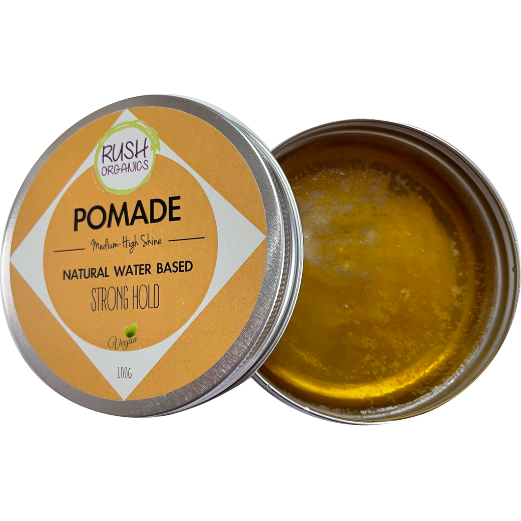 plastic free tin of organic vegan hair pomade gel, orange label saying 'medium-high shine, natural water based, strong hold'.