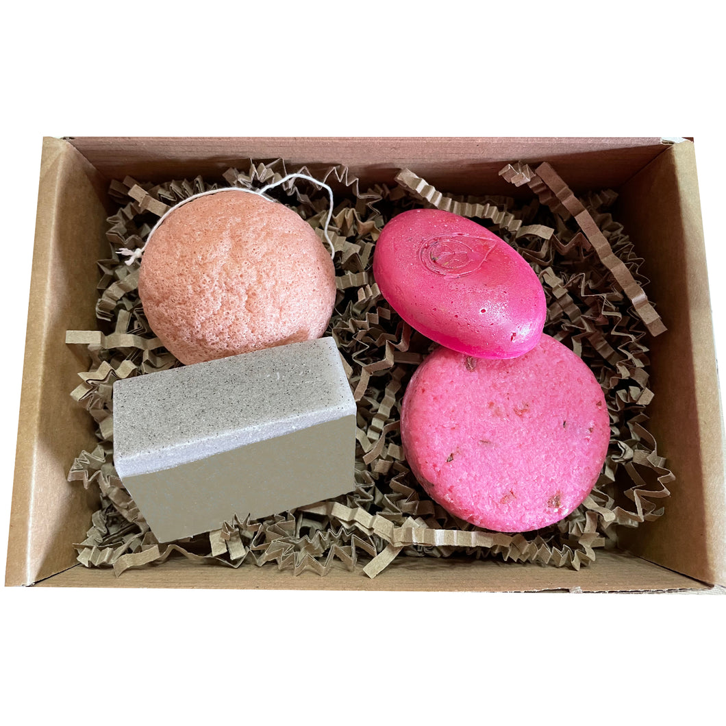 the floral one gift set, bundle containing konjac sponge, gardener's peppermint and pumice soap bar, flower power pink solid conditioner bar, rosey pink rose solid shampoo bar