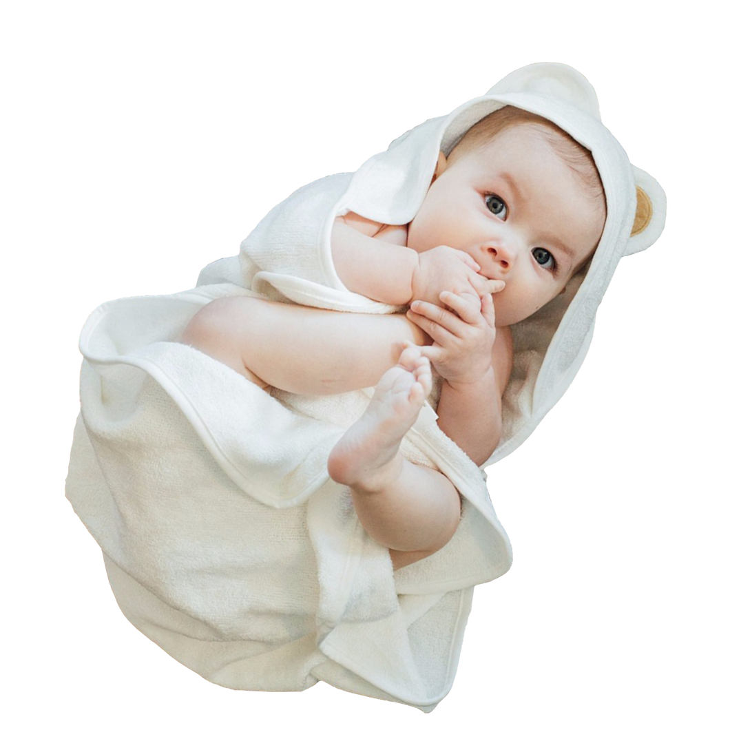 baby wrapped in bamboo hooded bath towel. hood has bear ears.