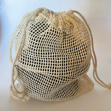 Load image into Gallery viewer, black bamboo make up remover pads in mesh laundry drawstring bag.
