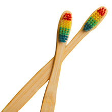 Load image into Gallery viewer, 2 overlapping kids rainbow bamboo toothbrushes
