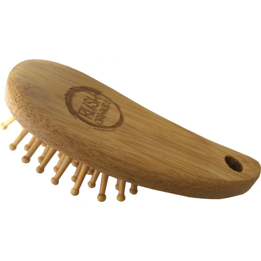 mini bamboo travel handbag hair brush with rush organics logo