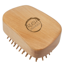 Load image into Gallery viewer, bamboo detangling hair brush tangle teaser with natural rubber. rush organics logo at the bottom on the handle. 
